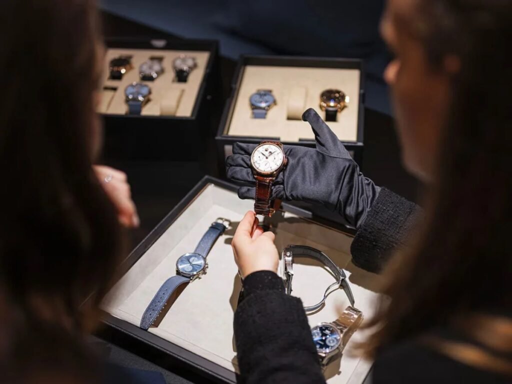 Visitors viewing luxury watches on display at Watches and Wonders Geneva 2025