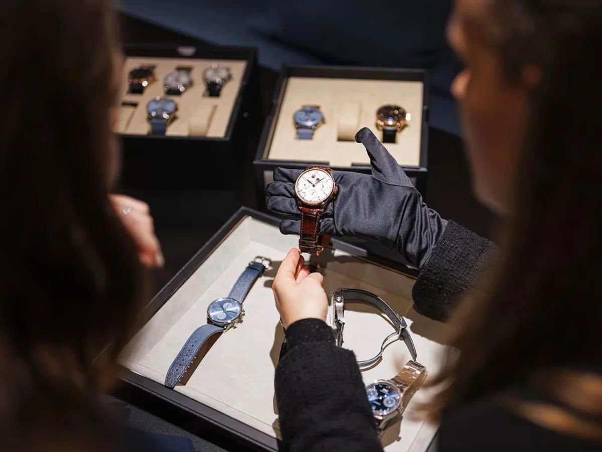 Visitors viewing luxury watches on display at Watches and Wonders Geneva 2025