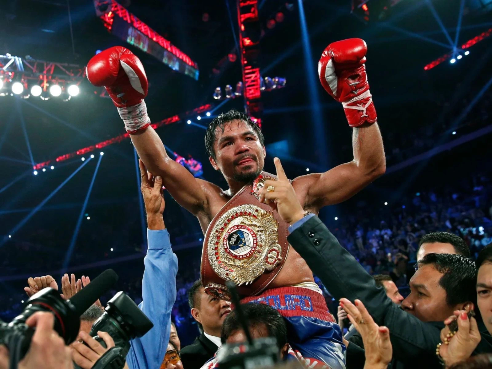 Professional Boxer Manny Pacquiao celebrating with the WBO International belt after defeating Brandon Ríos in November 2013.