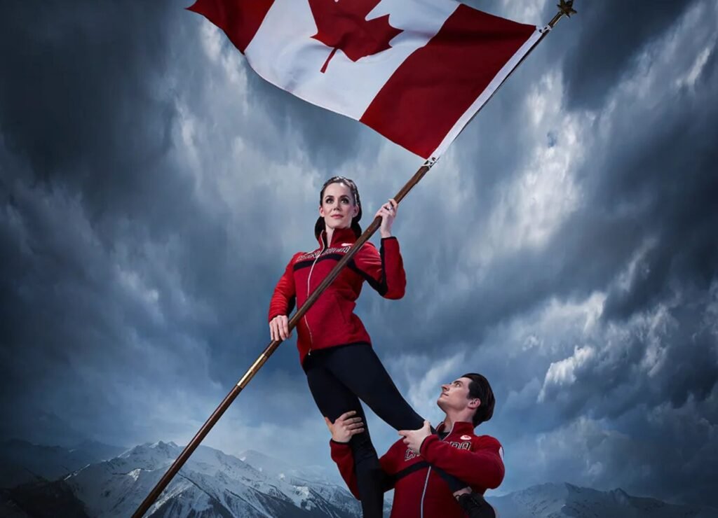 Canadian Olympians Mikaël Kingsbury and Marielle Thompson pose with the Canadian flag ahead of the Olympic Winter Games Milano Cortina 2026 Opening Ceremony.