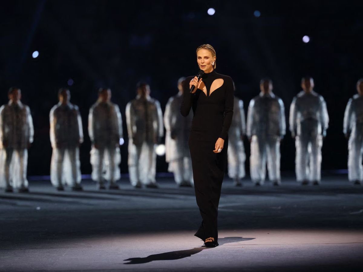 Charlize Theron delivers a speech at the Milano Cortina 2026 Winter Olympics opening ceremony. 