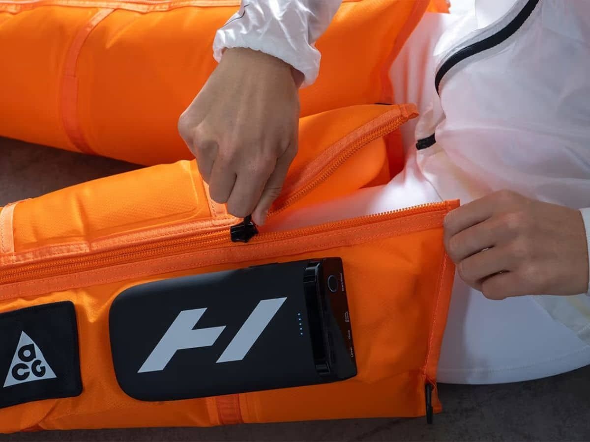Hyperice x Nike ACG Normatec Elite zippered sleeve and integrated control unit.