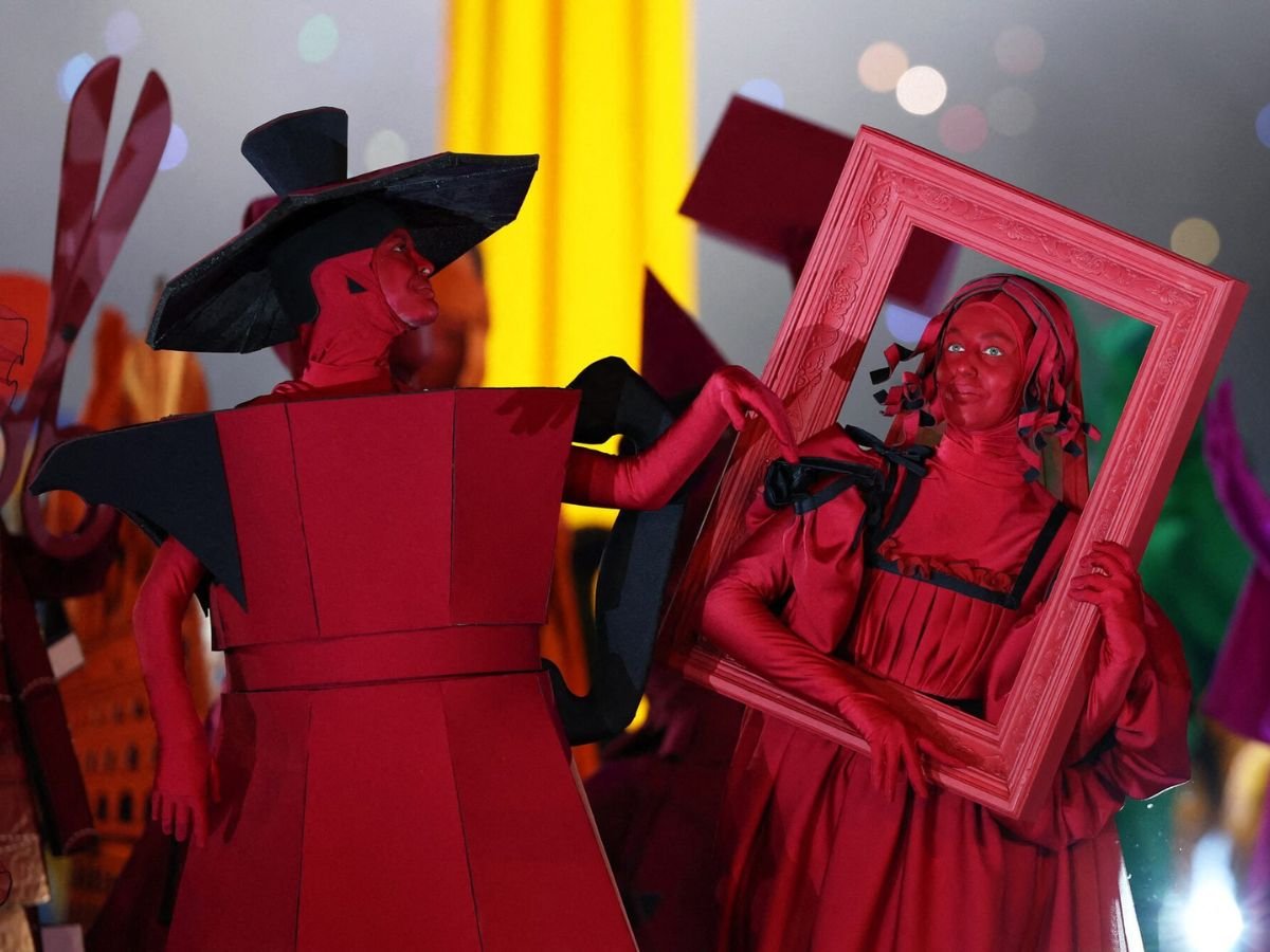 Performers portraying iconic figures from Italian art and culture at the Milano Cortina 2026 Winter Olympics opening ceremony.