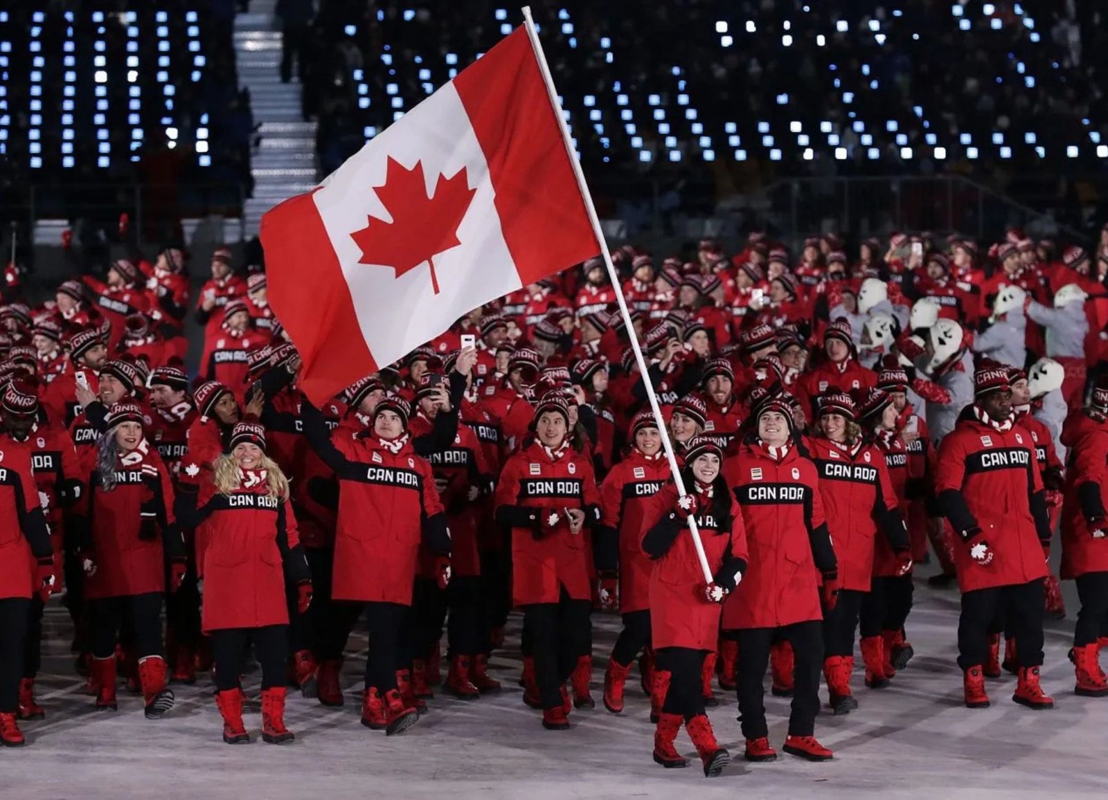 Team Canada athletes march behind the Canadian flag at the Opening Ceremony of the 2018 Winter Olympics in Pyeongchang, South Korea. The Canadian delegation featured a record 225 athletes, the country's largest-ever team at the Winter Olympic Games.