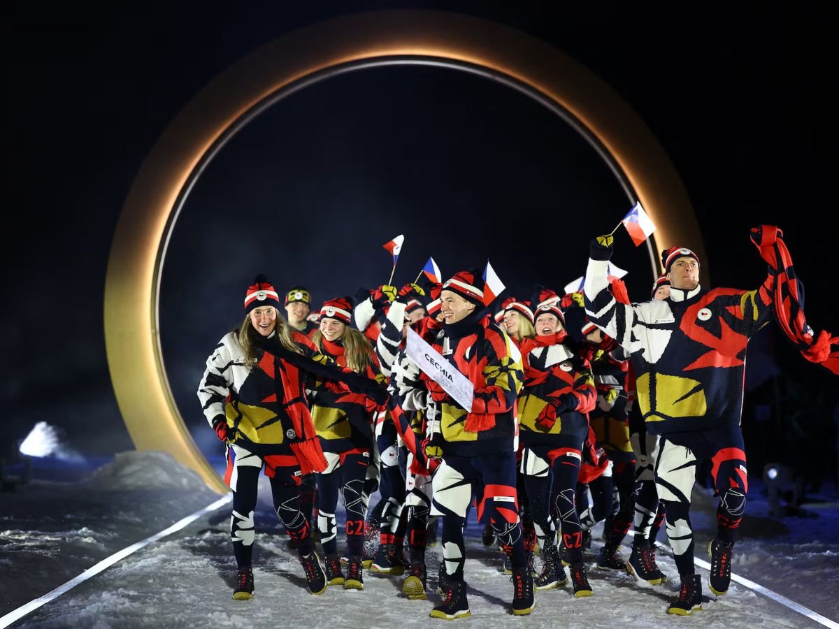 Team Czech Republic parades at the Milano Cortina 2026 Winter Olympics opening ceremony, with athletes in colourful uniforms waving Czech flags.