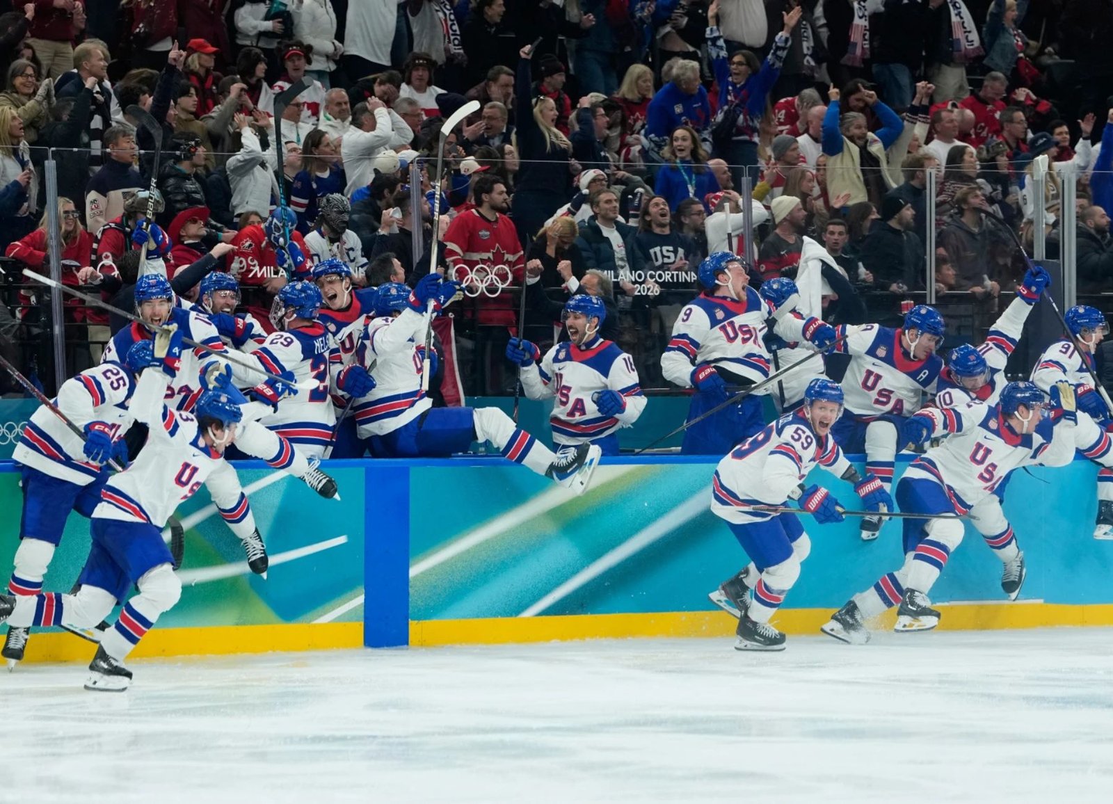 Team USA celebrates its overtime win over Canada to claim the men's hockey gold medal at the Olympic Winter Games Milano Cortina 2026.