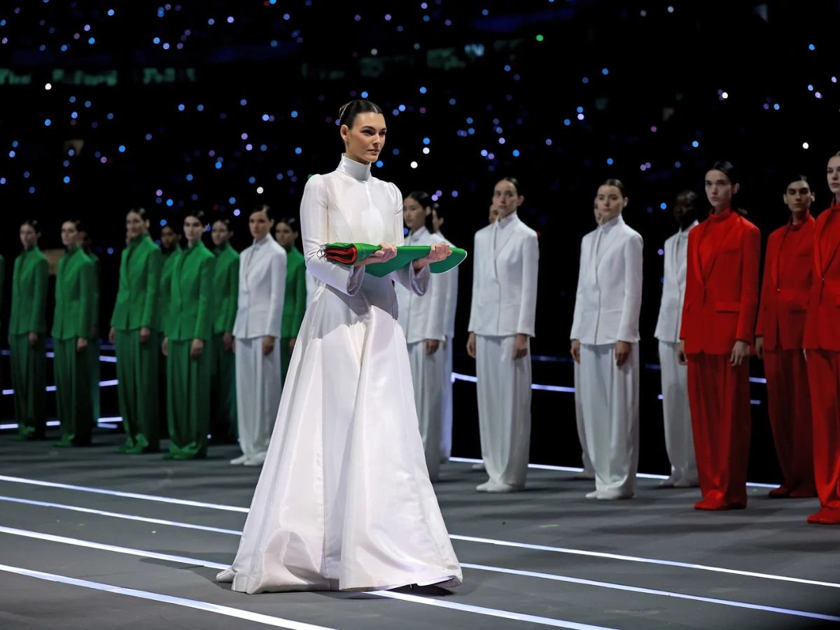 Vittoria Ceretti carries the Italian flag at the Milano Cortina 2026 Winter Olympics opening ceremony.