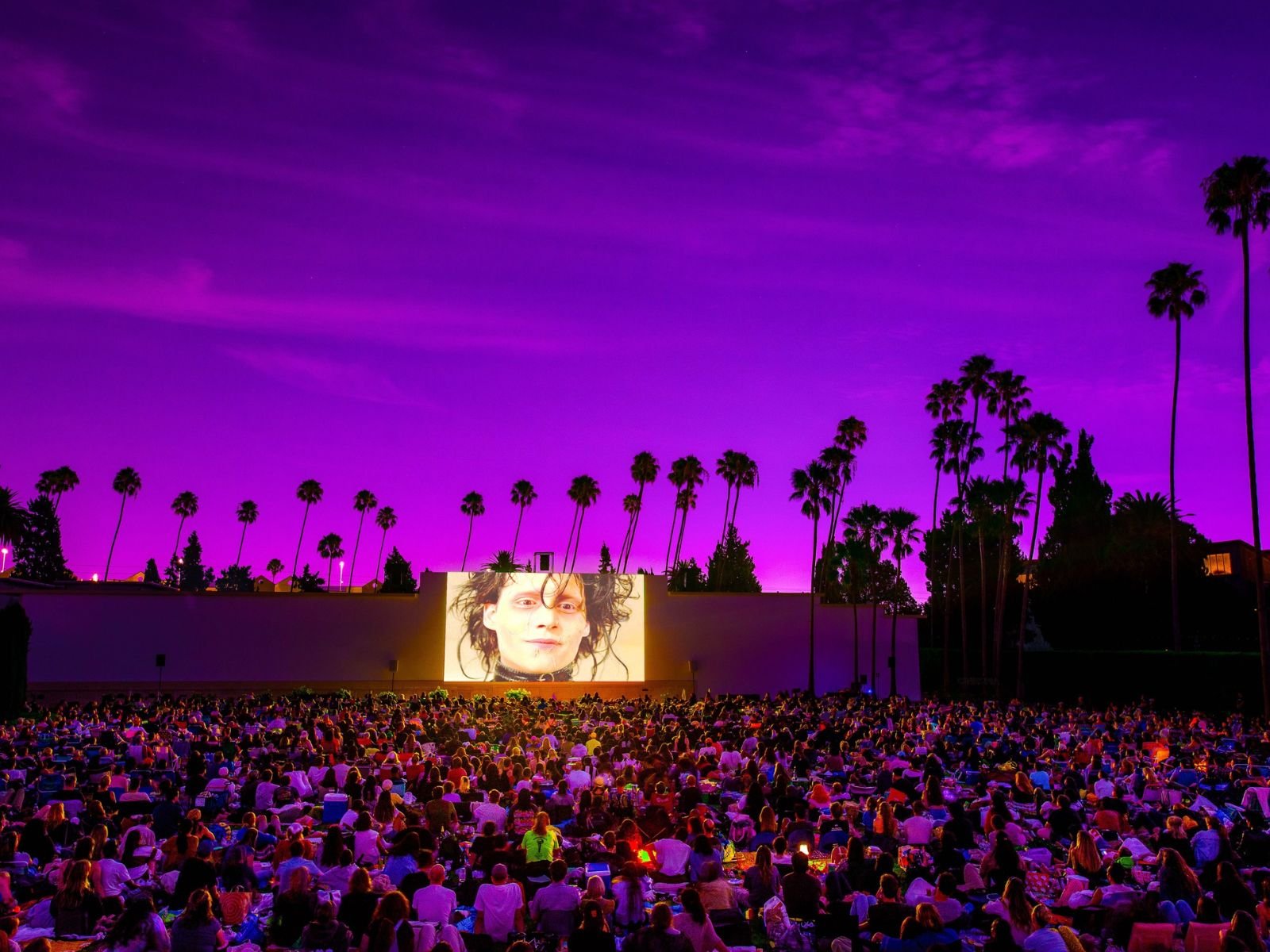A large crowd watches Edward Scissorhands at a Cinespia outdoor screening at Hollywood Forever Cemetery.