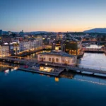 Aerial view of Geneva, illuminated at dusk during Watches and Wonders.