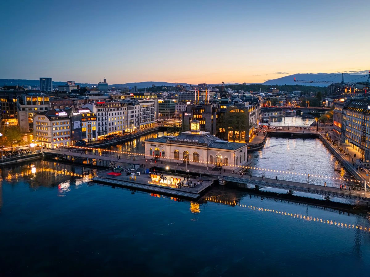 Aerial view of Geneva, illuminated at dusk during Watches and Wonders.